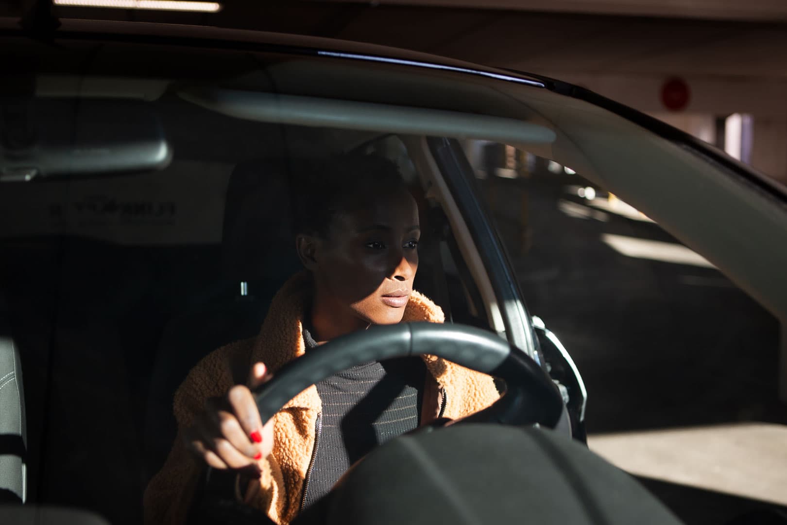 Portrait of a woman sitting in a car